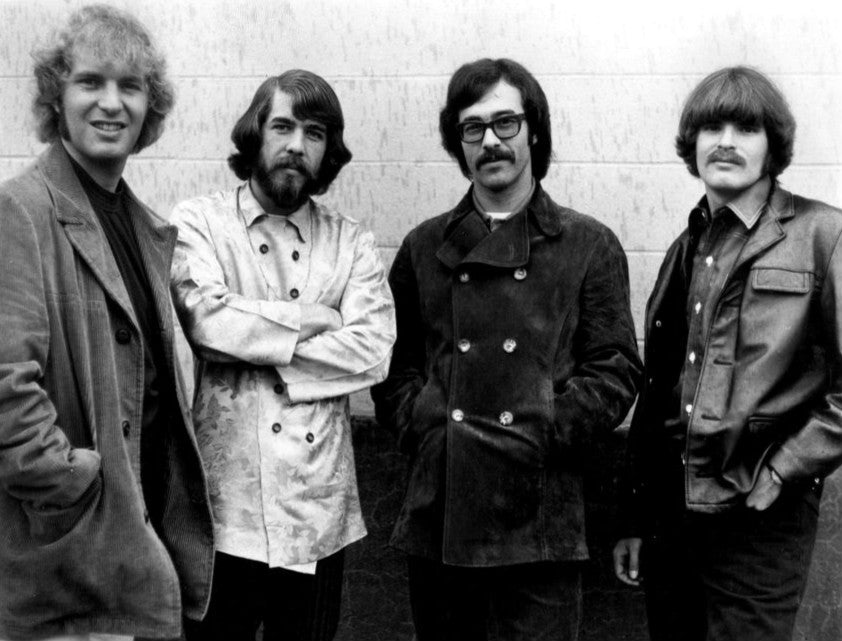 Tom Fogerty, Doug Clifford, Stu Cook en John Fogerty samen